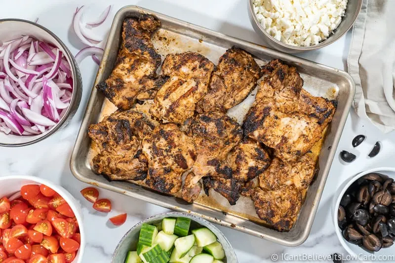 Chicken on tray for Greek Chicken Bowl Recipe