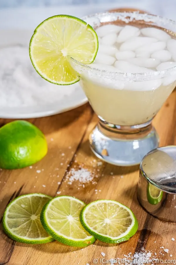 Keto Margarita in a glass with salt rim and limes