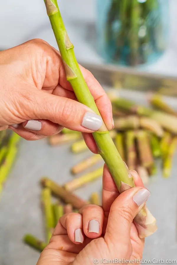 snapping asparagus stalks