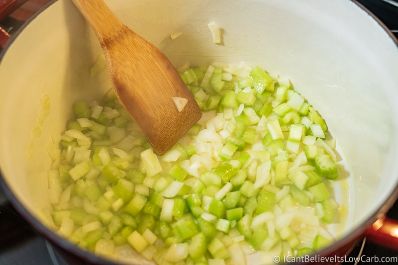 frying celery and onions in a pan for Butternut Squash Soup