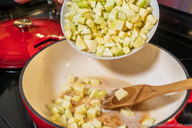 pouring yellow squash and zucchini for low carb Apple Crisp recipe