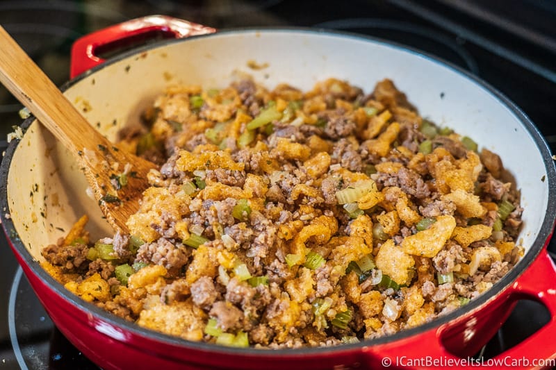 stirring in pork rinds with low carb Keto Stuffing Recipe