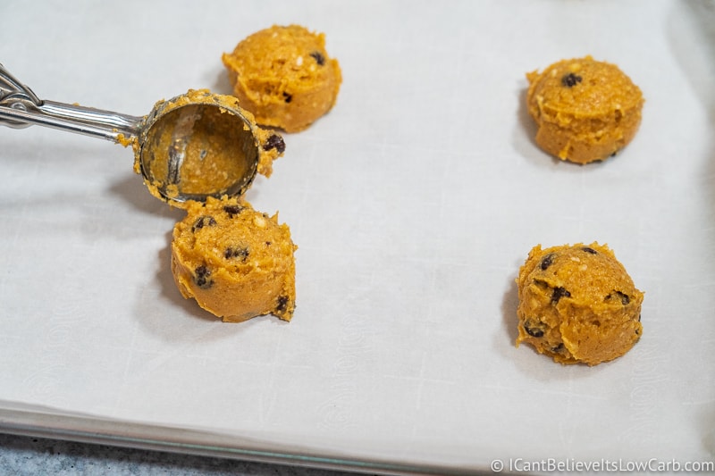 scooping out keto Pumpkin Chocolate Chip Cookies