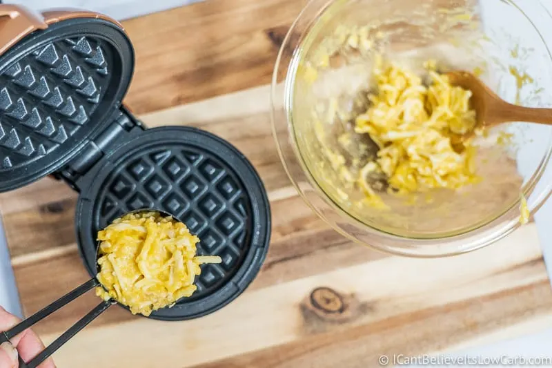 putting eggs and cheese into Keto Chaffles