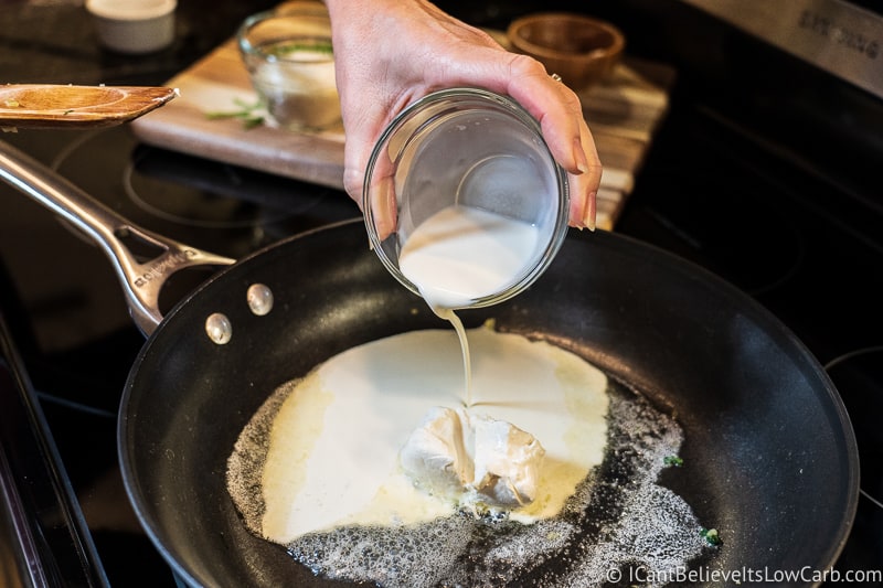 pouring heavy cream for Keto Creamed Spinach