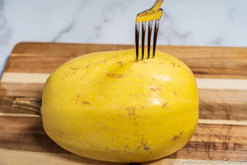 poking holes in spaghetti squash with fork to put in microwave