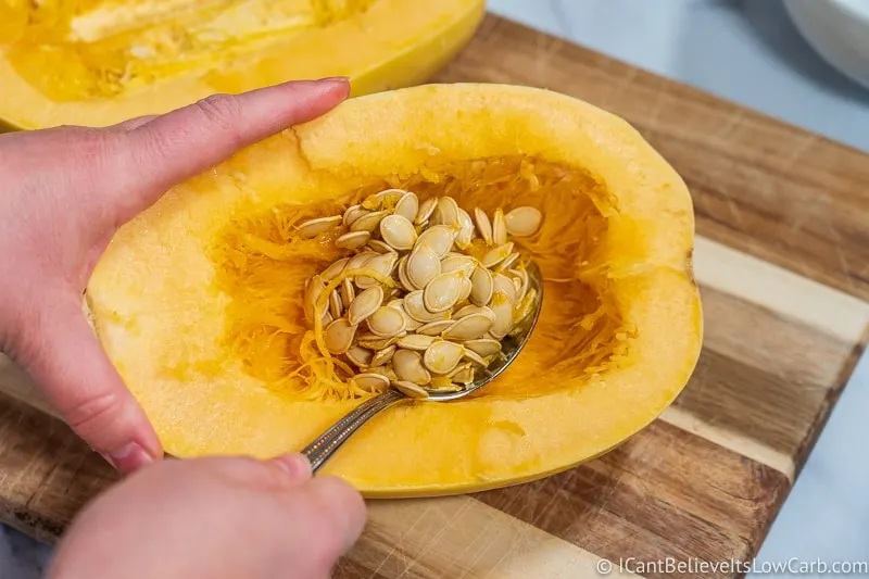 scooping out Spaghetti Squash seeds