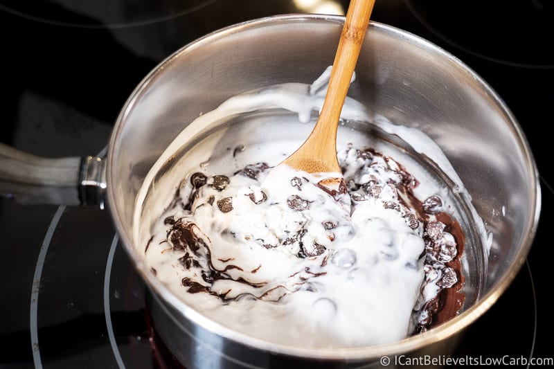 stirring together chocolate ingredients Keto Almond Joy Bars