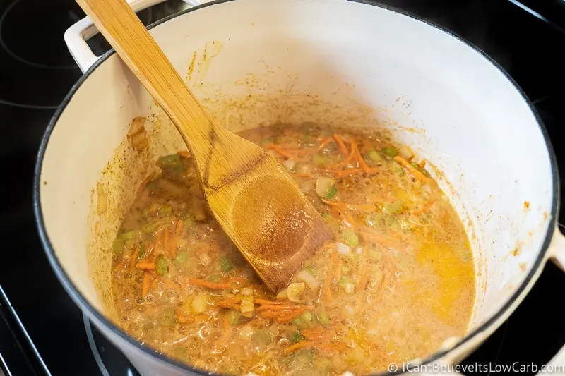 stirring Broccoli Cheddar Soup to prepare