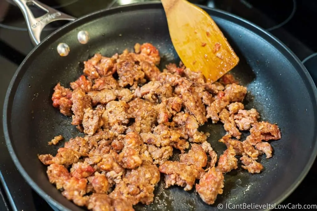 sausage cooking on stove for Keto Stuffed Mushrooms