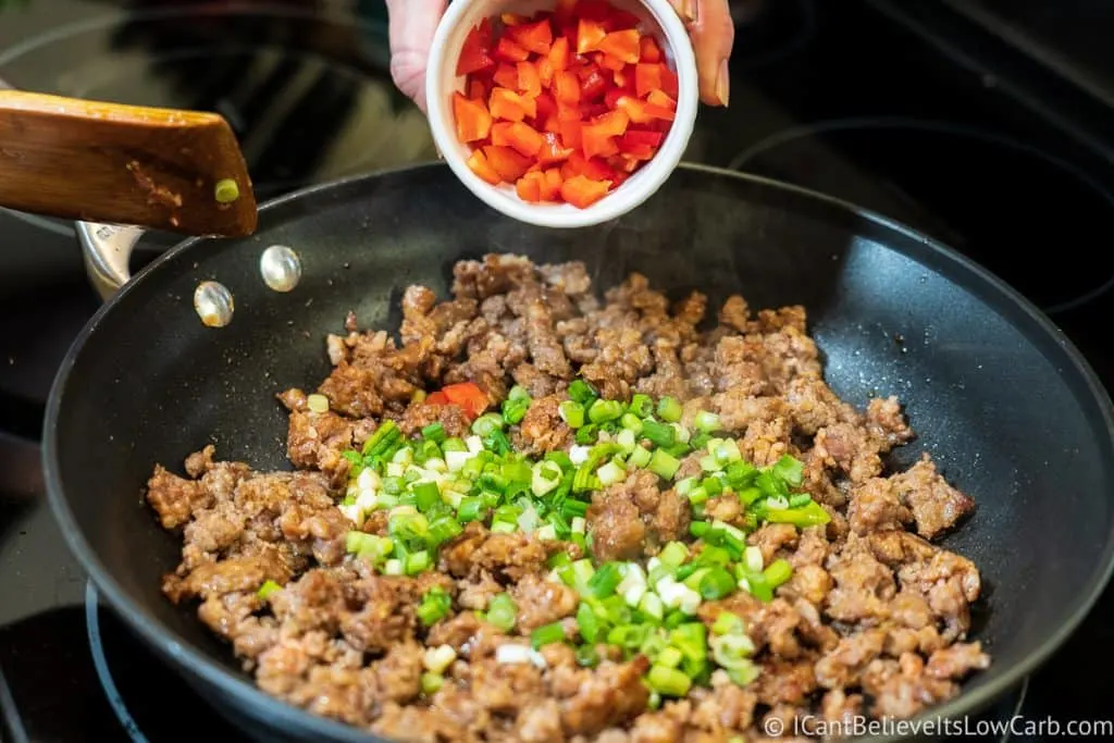 adding peppers to Low Carb Stuffed Mushrooms