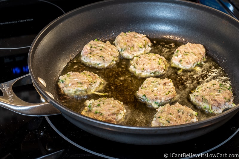 Frying Chicken Zucchini Poppers in a pan