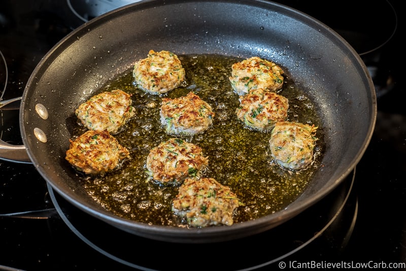 Frying Paleo Chicken Zucchini Poppers in olive oil