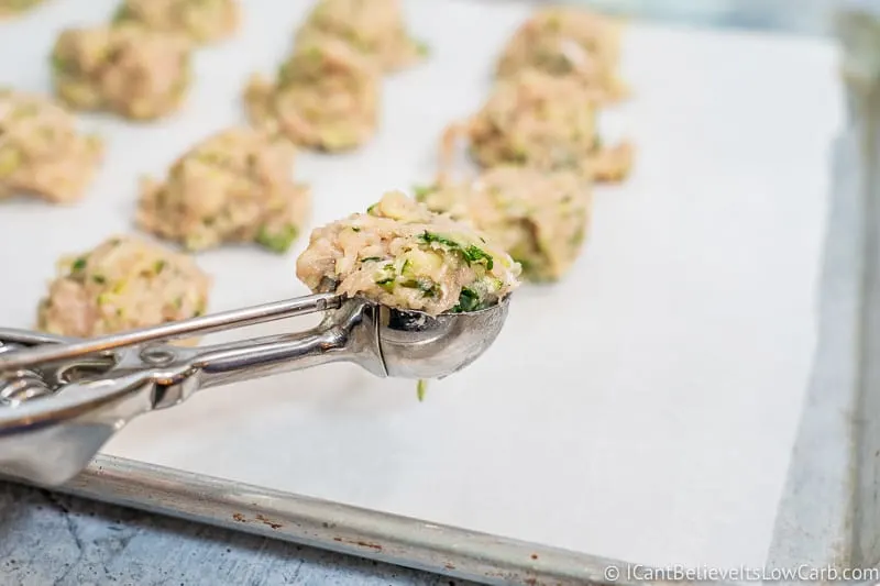 scooping out Chicken Zucchini Poppers