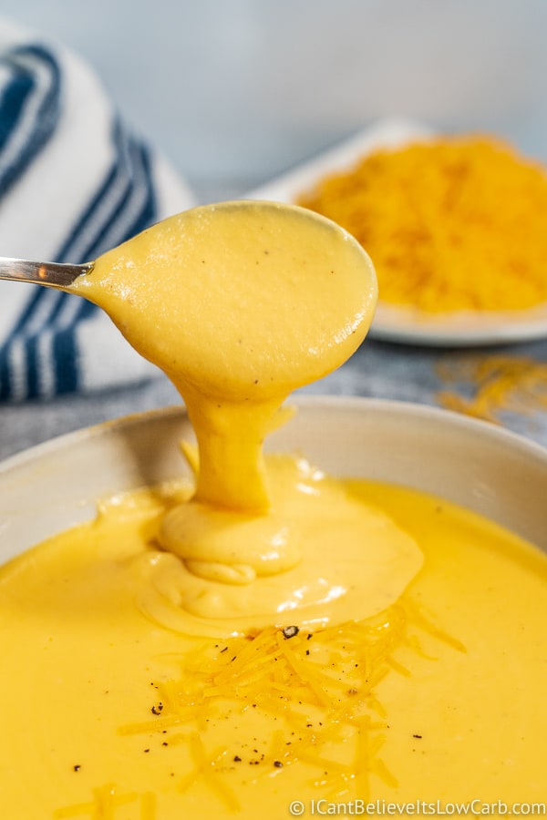 Spoon of Low Carb Cheddar Cheese Sauce