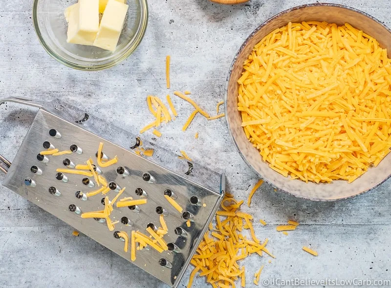 grating cheddar cheese for Keto cheese sauce
