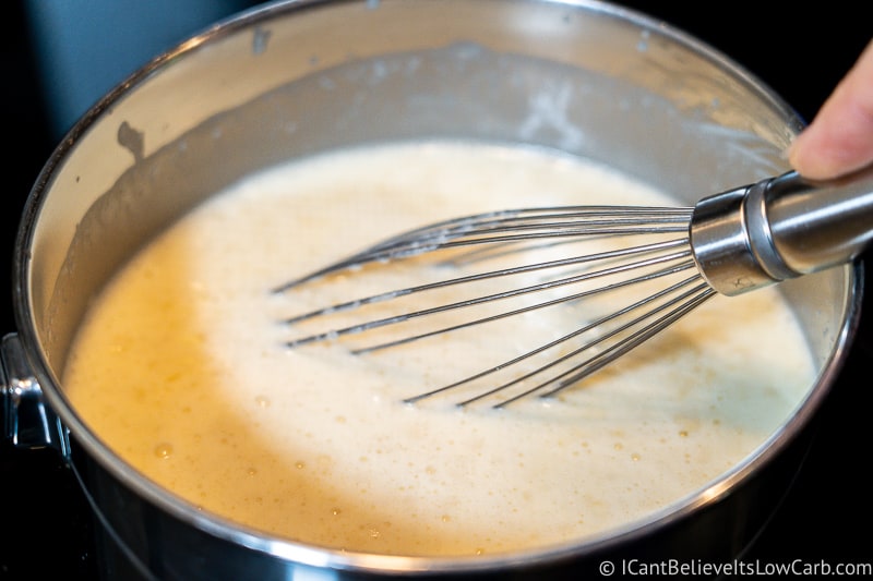 mixing custard for low carb Ice Cream in a pan on the stove