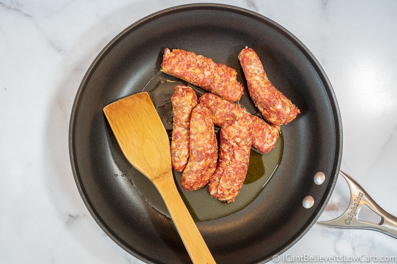 Italian sausage in frying pan with oil