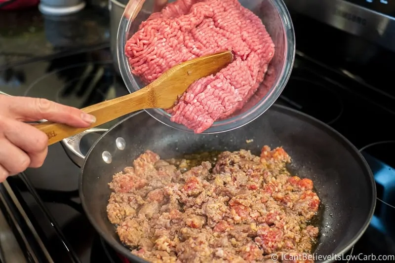 adding ground beef to sausage for Keto Stuffed Peppers