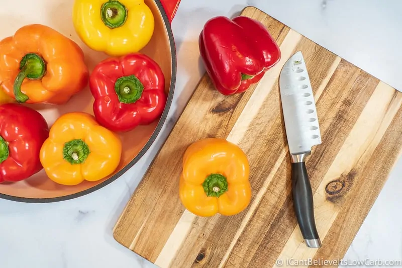 Bell peppers on cutting board with knife