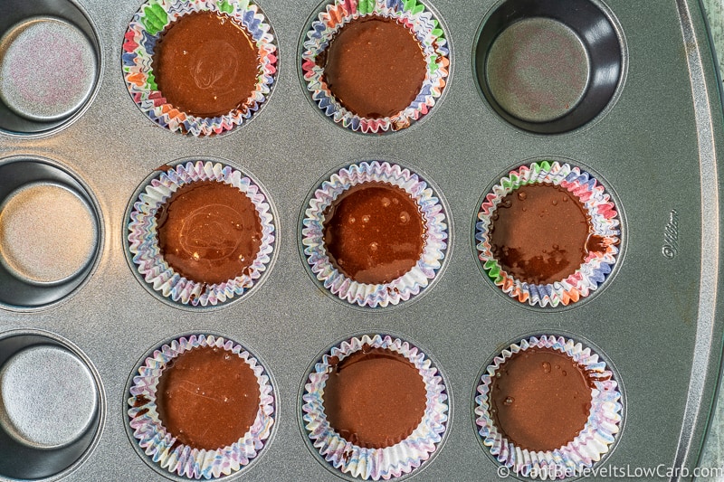 Chocolate layer for Peanut Butter Fat Bombs in muffin tray