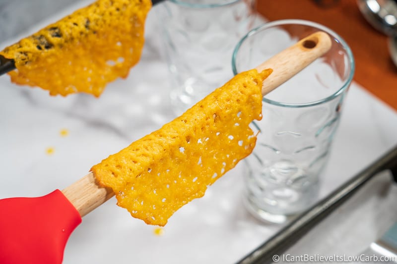 Keto Cheese Taco Shell hanging on wooden spoon