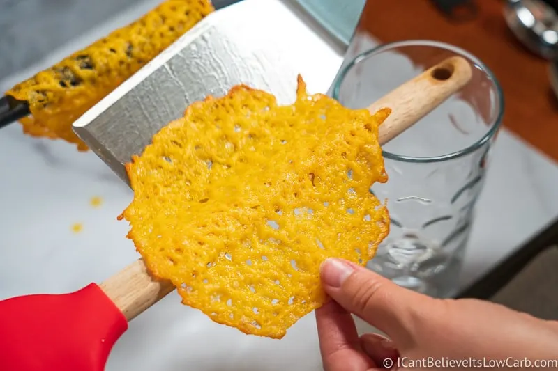 placing Cheese Taco Shell on wooden handle