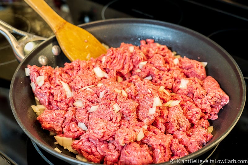 ground beef and onions frying on stove