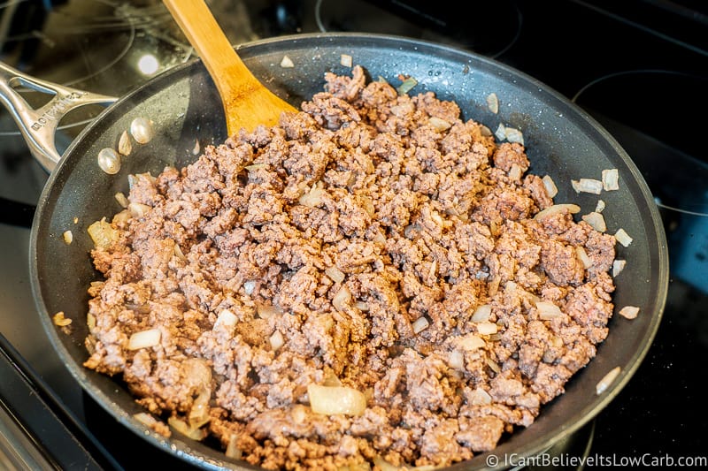 ground beef frying on stove in pan for casserole