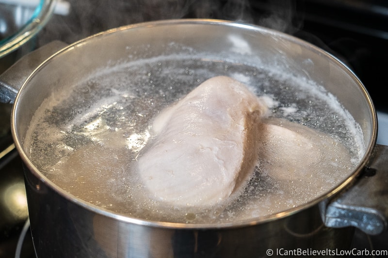poaching Chicken in a pot of boiling water