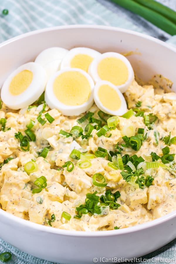 White bowl of Keto Egg Salad with fresh eggs