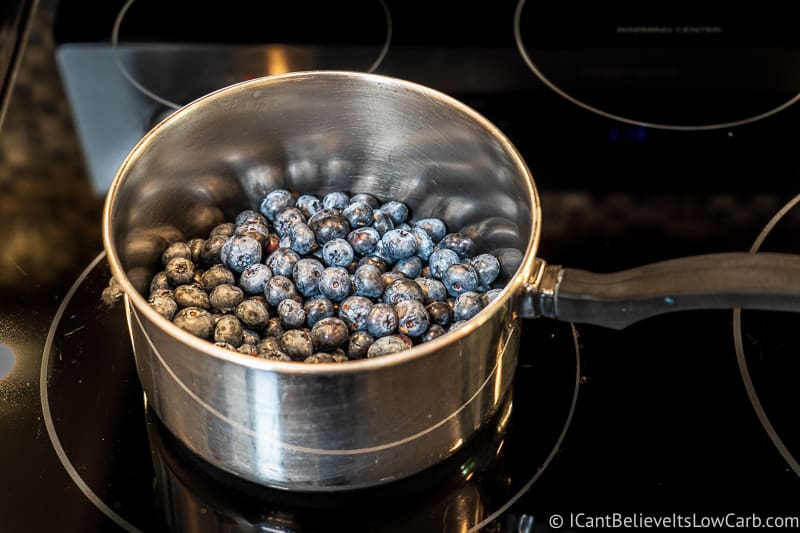 making Keto Blueberry Pie filling on the stove