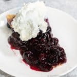 Keto Blueberry Pie slice with whipped cream