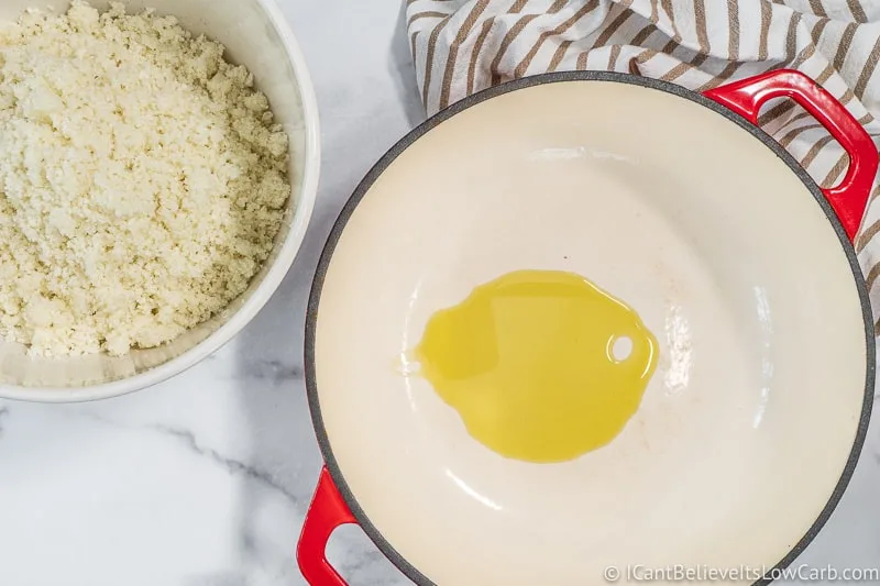 olive oil in a pan and bowl of Cauliflower Rice
