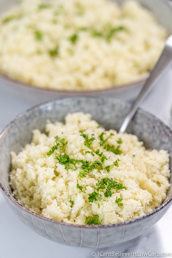 Riced Cauliflower in a bowl with a spoon