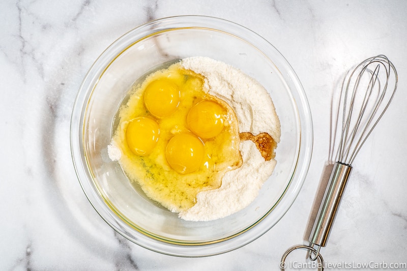adding eggs to sugar free lemon curd in bowl