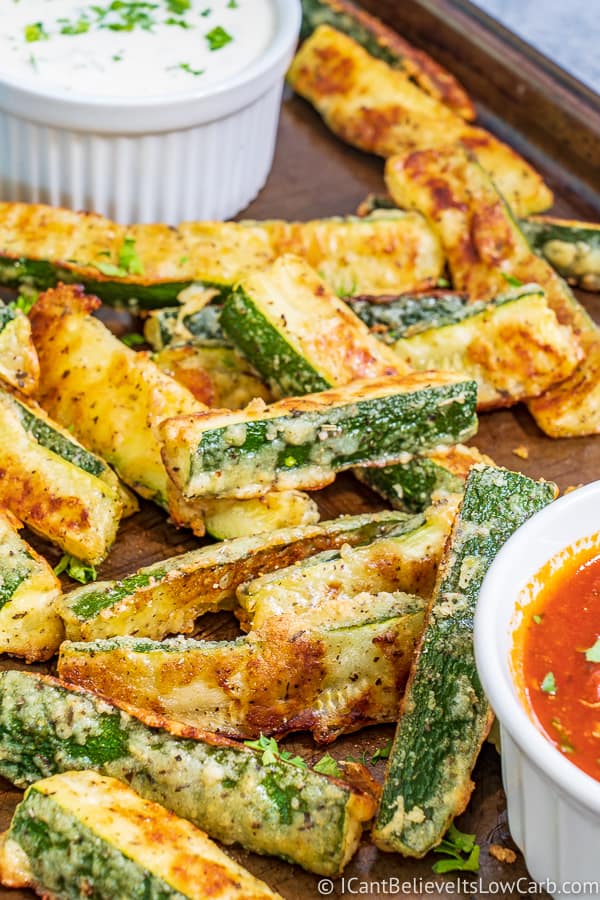 Zucchini Fries piled up on a baking tray