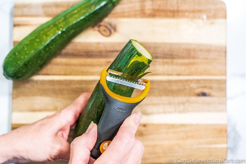 preparing zoodles with peeler