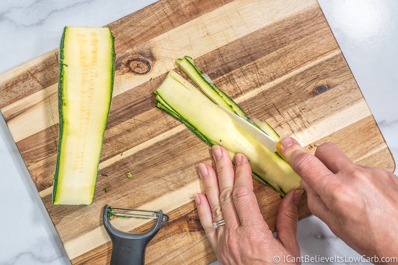thin Zucchini Noodles with a knife