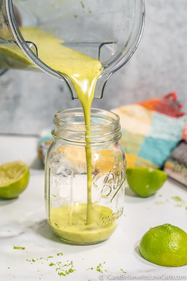 pouring Cilantro Lime Dressing into a jar