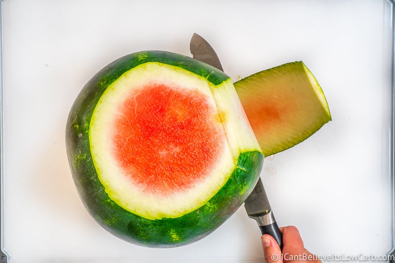 Peeling the rind of a Watermelon