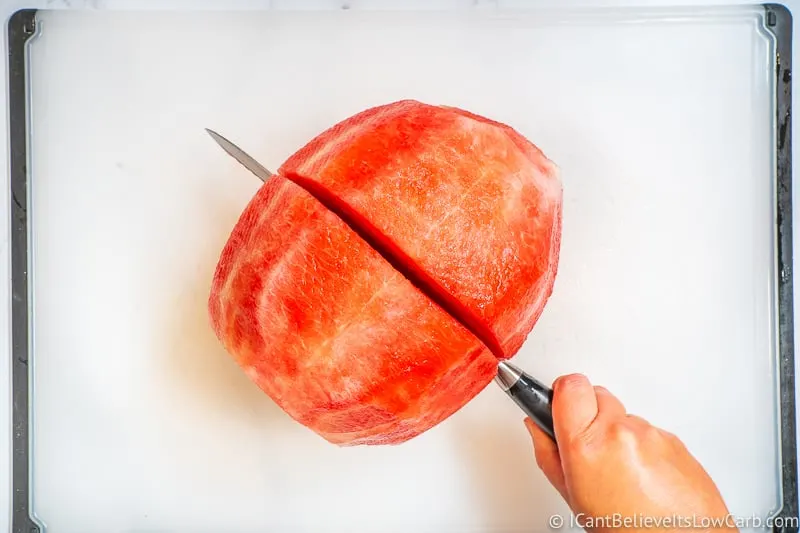 Slicing peeled Watermelon in half