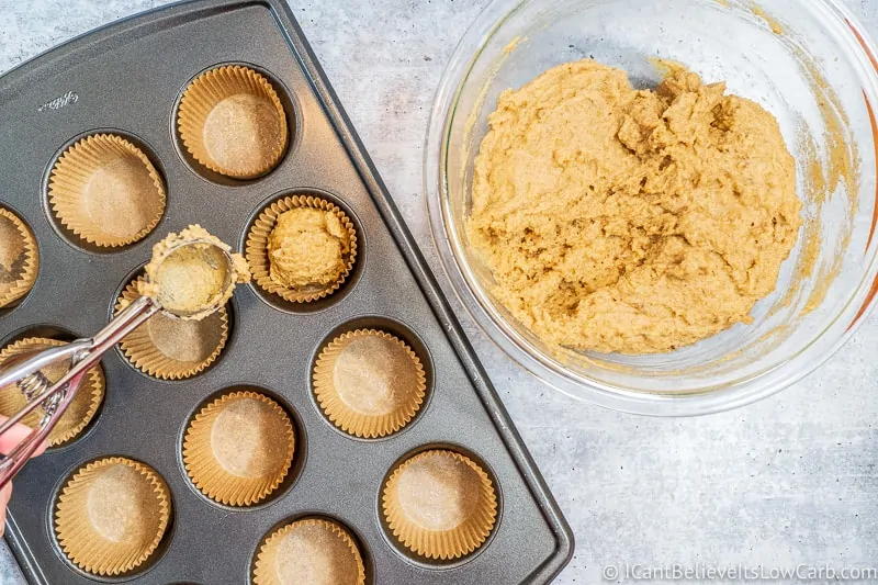adding mix into muffin liners