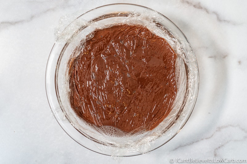 Keto Chocolate Pudding covered in plastic wrap