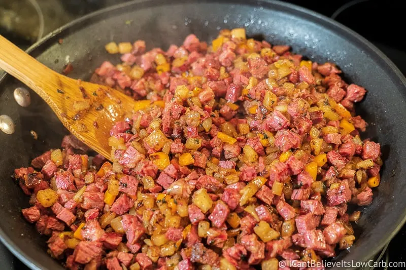 Spoonful of Keto Corned Beef Hash on the stove
