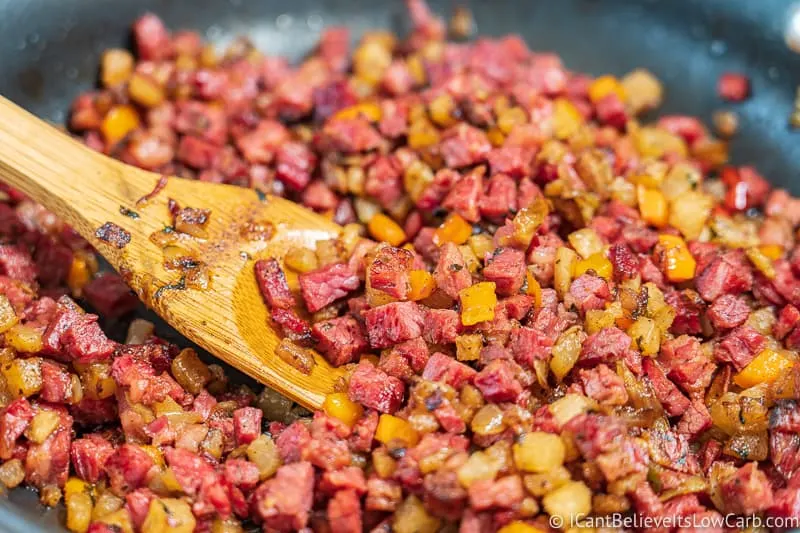 stirring Low Carb Corned Beef Hash on the stove