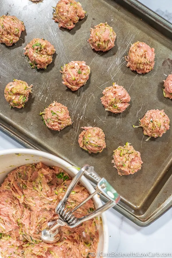 Uncooked Turkey Zucchini Meatballs on baking sheet