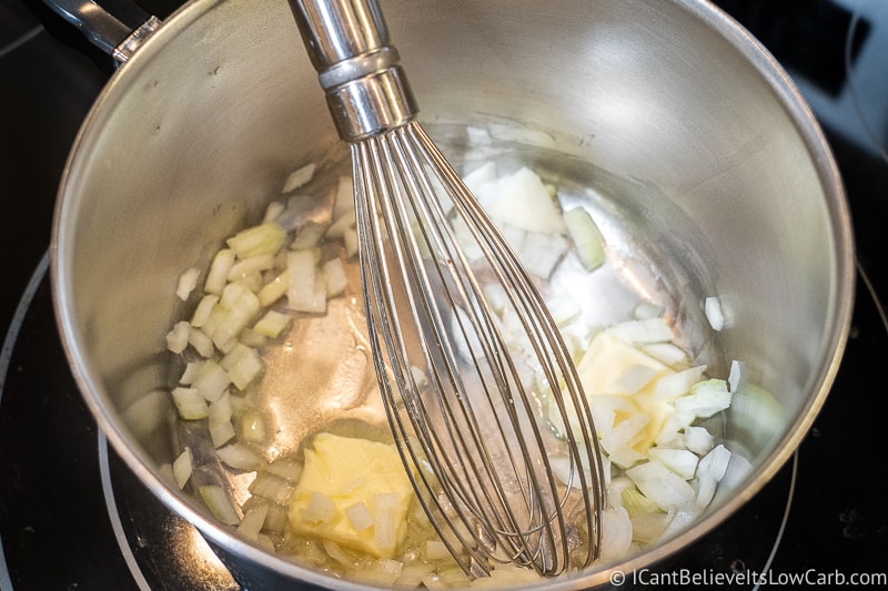 whisking onions and butter