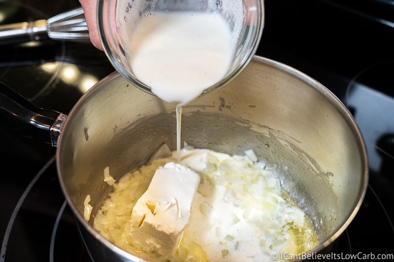 pouring heavy cream for Zucchini Casserole