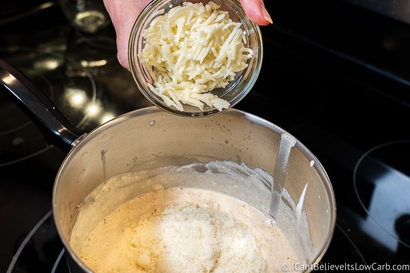 adding mozzarella cheese to Zucchini Casserole